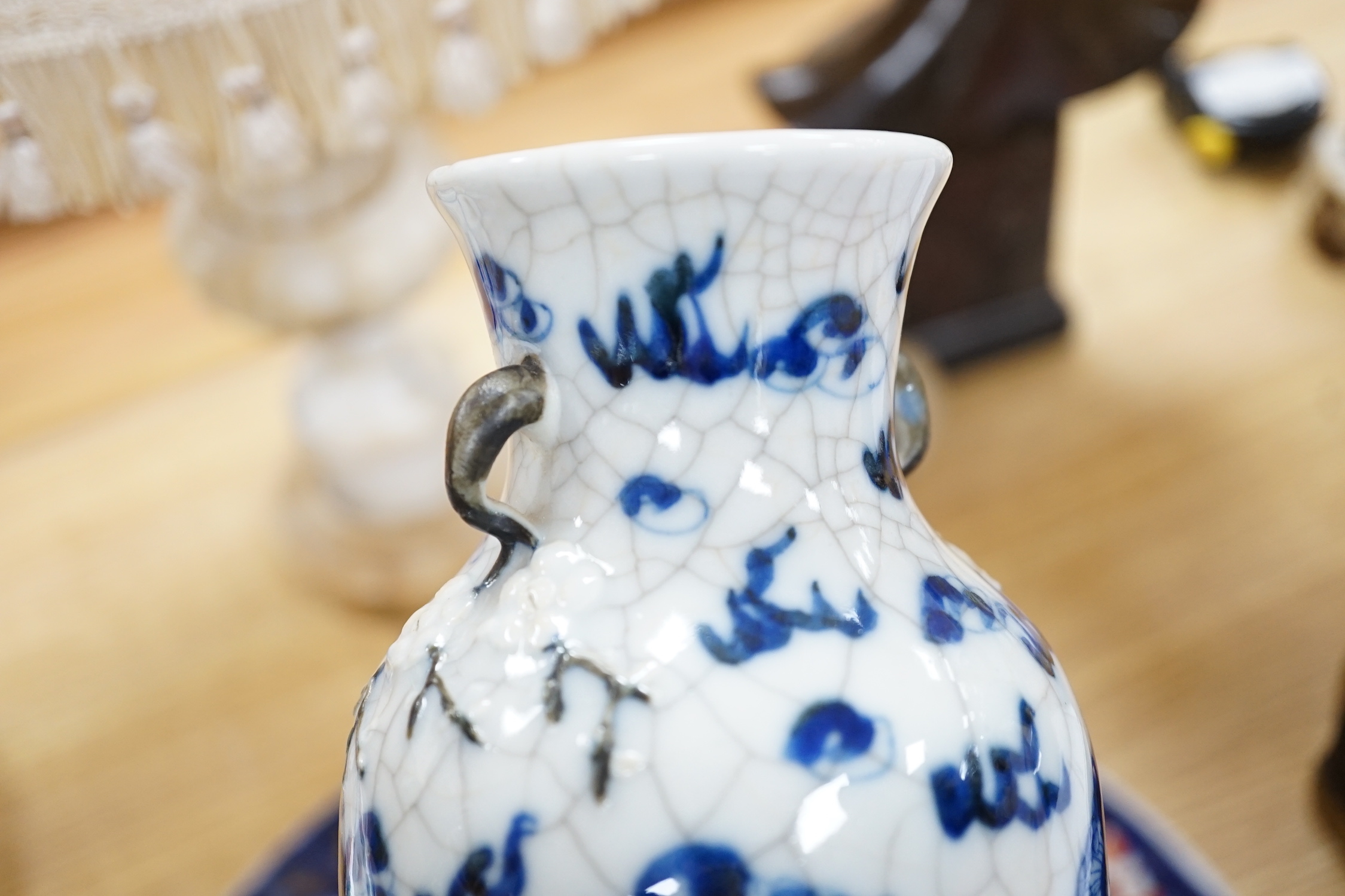 A Chinese two handled crackle glaze vase, Kangxi mark, but late 19th century, together two Imari plates, 37cm diameter